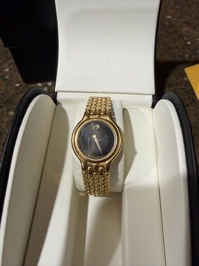 Movado Gold Tone Ladies Watch with Black Dial